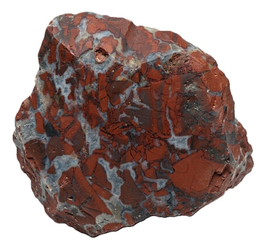 Raw brecciated red jasper specimen sians emporium Rough brecciated red jasper mineral specimen showing angular brick red fragments cemented with grey and white chalcedony quartz veining