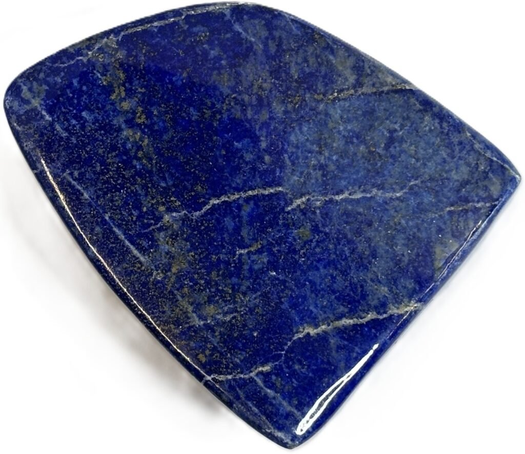 Natural polished lapis lazuli freeform stone sians emporium Polished triangular freeform lapis lazuli stone showing deep royal blue lazurite fine calcite veins and brassy golden pyrite flecks